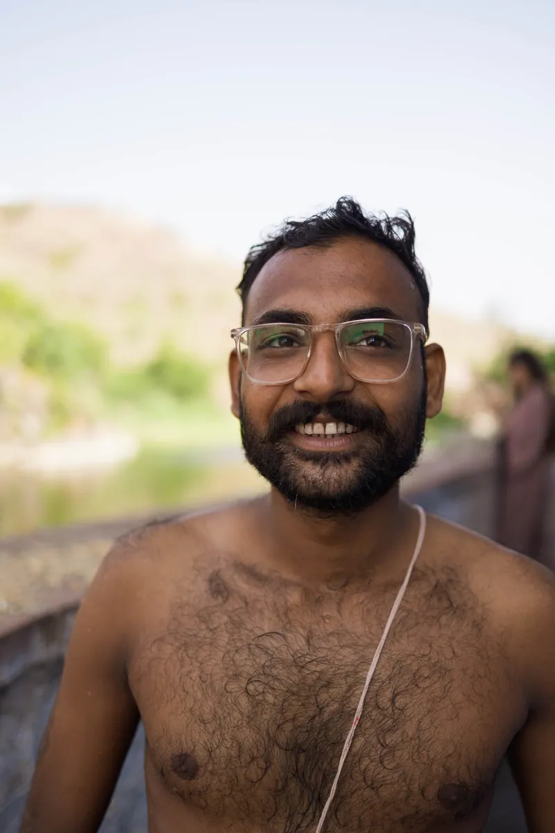 Rahul. When I came across a small lake in the shadow of the great fort in Jodhpur, many people were taking part in a Pitru Paksha religious ceremony. Rahul kindly invited me to join in, and patiently guided me through the process. Jodhpur, India