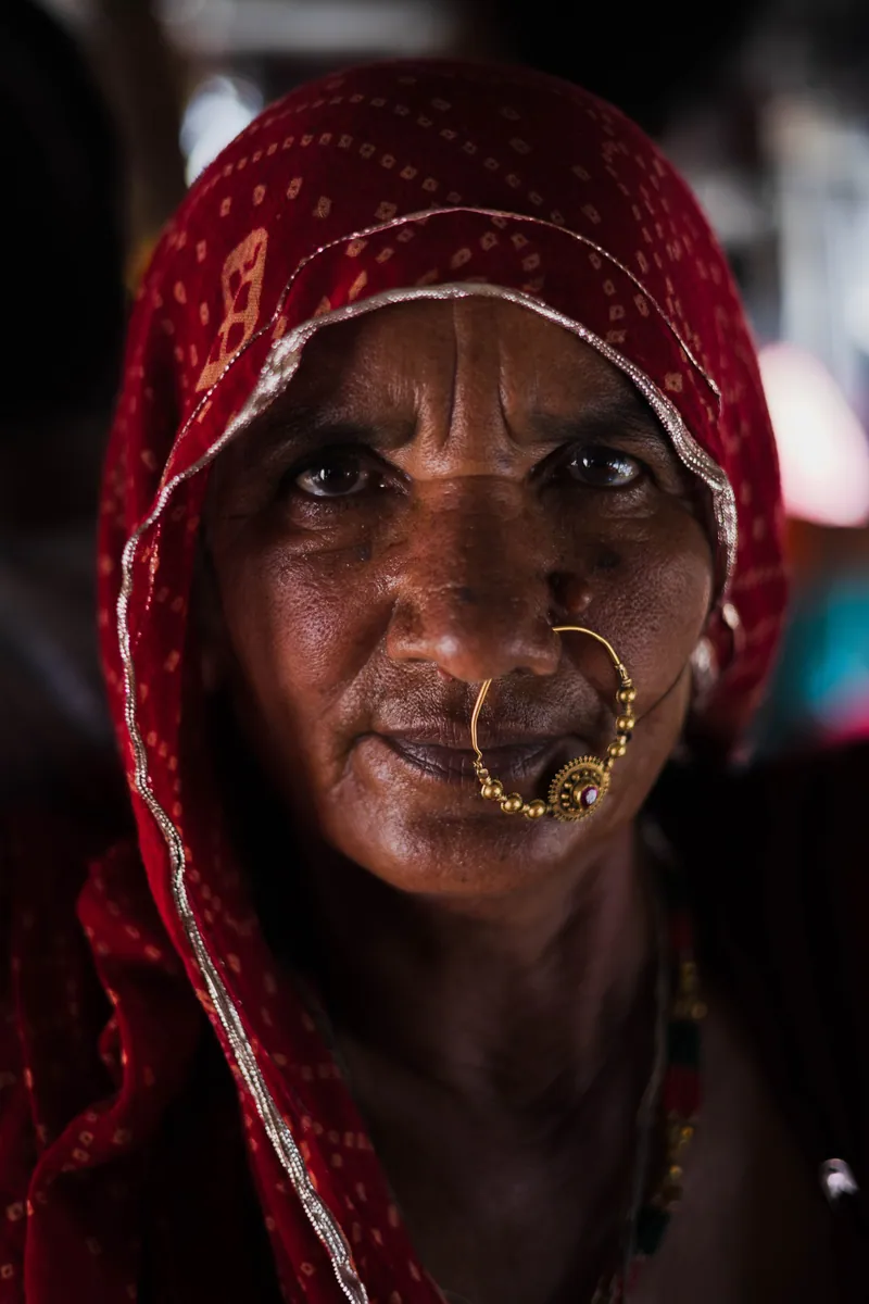 Woman from Pushkar. This woman was directly in front of me on a packed standing room only bus. She had a powerful gaze and an amazing nose ring and asked if I could take a portrait. Pushkar, India
