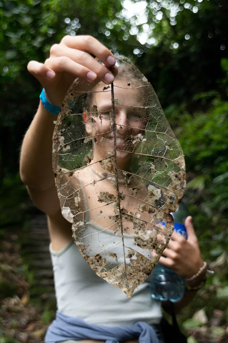 Jolanda. A German friend I met trekking to the ‘Lost City’ in Colombia holding up a beautiful leaf skeleton. Sierra Nevada Jungle, Columbia